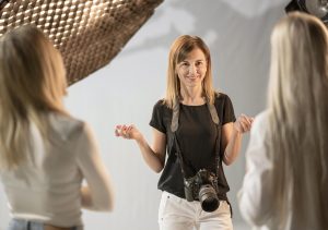 female photographer models talking